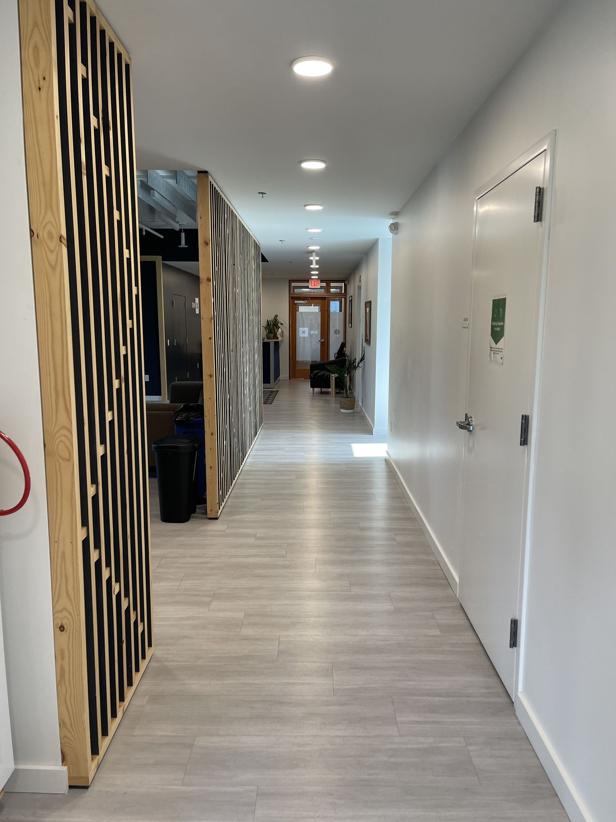 Clean corridor running the length of an office floor