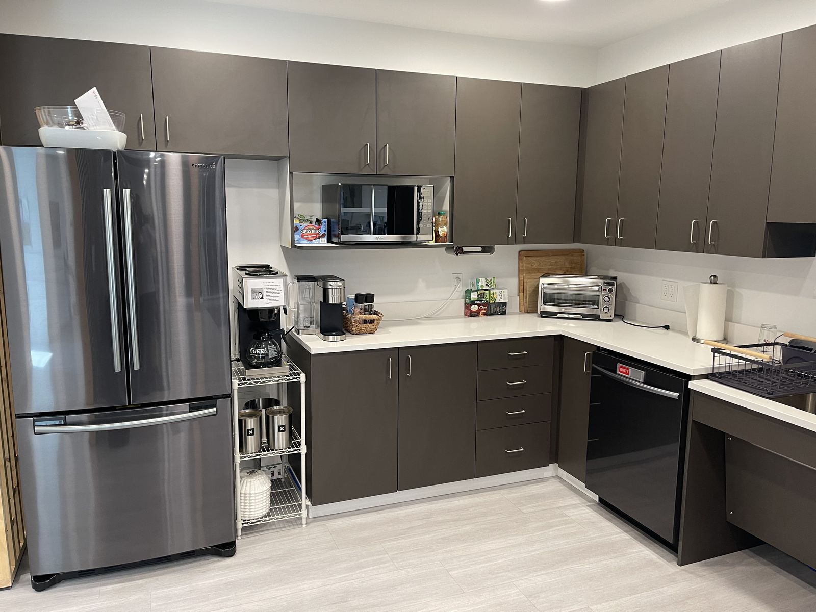 Office kitchen with counters and appliances wiped down